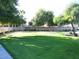 Greenbelt with trees and grassy area, providing a beautiful outdoor space at 1902 N 106Th Ave, Avondale, AZ 85392