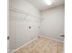The laundry room has tiled flooring and includes hook-ups for a washer and dryer at 1902 N 106Th Ave, Avondale, AZ 85392
