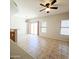 Open concept living area with tile floors, natural light, connecting kitchen and dining spaces at 1902 N 106Th Ave, Avondale, AZ 85392