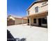 Covered patio with ceiling fan and sliding glass door with access to the yard at 1902 N 106Th Ave, Avondale, AZ 85392