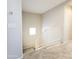 A carpeted staircase leads to the upper level of the home with white railings at 1902 N 106Th Ave, Avondale, AZ 85392
