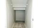 A walk-in closet featuring neutral paint, carpeted flooring, and wire shelving at 1902 N 106Th Ave, Avondale, AZ 85392