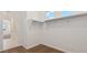Walk in closet with carpet flooring, shelving, and ample storage space at 2024 W Sheridan Ave, Apache Junction, AZ 85120