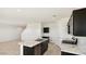 Bright kitchen features a marble island and stainless steel appliances at 2024 W Sheridan Ave, Apache Junction, AZ 85120