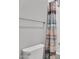 Bright bathroom with a toilet, shower curtain, shower head, and towel rack at 20269 E Hummingbird Dr, Queen Creek, AZ 85142