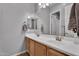 This bathroom features double sinks, a large mirror, and modern fixtures at 20269 E Hummingbird Dr, Queen Creek, AZ 85142