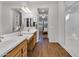 This bathroom includes double sinks with white countertops and wood cabinets at 20269 E Hummingbird Dr, Queen Creek, AZ 85142