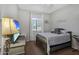 Bright bedroom featuring a window with natural light, a comfortable bed, and a workstation at 20269 E Hummingbird Dr, Queen Creek, AZ 85142