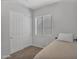 Cozy bedroom featuring natural light from the window and a spacious closet at 20269 E Hummingbird Dr, Queen Creek, AZ 85142