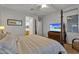 The beautiful primary bedroom features a four poster bed, TV, and ensuite bath at 20269 E Hummingbird Dr, Queen Creek, AZ 85142