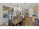 Open dining area with chandelier, patio access, and view of living space at 20269 E Hummingbird Dr, Queen Creek, AZ 85142