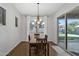 Bright dining area with chandelier lighting and access to the backyard at 20269 E Hummingbird Dr, Queen Creek, AZ 85142