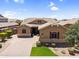 Charming single-Gathering home with a well-manicured front yard and neutral color palette at 20269 E Hummingbird Dr, Queen Creek, AZ 85142
