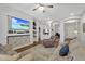 Spacious living room with hardwood flooring, decorative shelving, and comfortable seating arrangement at 20269 E Hummingbird Dr, Queen Creek, AZ 85142