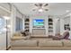 Cozy living room includes built-in shelving, a large television, and plush seating for relaxation at 20269 E Hummingbird Dr, Queen Creek, AZ 85142