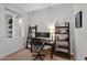 Home office with desk and ladder shelf on neutral carpet at 20269 E Hummingbird Dr, Queen Creek, AZ 85142
