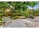 Scenic view of a park with walking path, lush green trees, flower beds and benches at 20269 E Hummingbird Dr, Queen Creek, AZ 85142