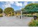 A park area featuring a shaded picnic table, trash receptacle, and a barbeque at 20269 E Hummingbird Dr, Queen Creek, AZ 85142