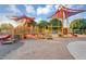 A playground featuring multiple play structures with shade canopies at 20269 E Hummingbird Dr, Queen Creek, AZ 85142