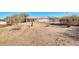 Desert backyard featuring mature landscaping, dry brush and rocks at 21 E Irvine Rd, Phoenix, AZ 85086