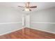 Neat bedroom with hardwood floors, trim detailing and neutral paint at 21 E Irvine Rd, Phoenix, AZ 85086
