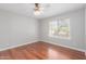 Cozy bedroom featuring a ceiling fan and natural light from a bright window at 21 E Irvine Rd, Phoenix, AZ 85086