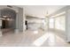 Large kitchen with island, white cabinetry, tile floors, and plenty of natural light at 21 E Irvine Rd, Phoenix, AZ 85086