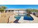 Backyard featuring a pool with a diving board, deck, fenced perimeter and the home's exterior at 21 E Irvine Rd, Phoenix, AZ 85086