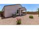 A beautiful backyard with patio and low maintenance desert landscaping is ready for entertaining at 28512 N Geode Dr, San Tan Valley, AZ 85143