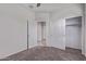 A bedroom with carpet, neutral walls, and closet creates a cozy and organized space for rest and relaxation at 28512 N Geode Dr, San Tan Valley, AZ 85143