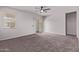 Spacious carpeted bedroom with a sliding glass door for natural light at 28512 N Geode Dr, San Tan Valley, AZ 85143