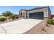 Charming single-story home with a two-car garage, desert landscaping, and a concrete driveway at 28512 N Geode Dr, San Tan Valley, AZ 85143