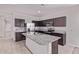 Modern kitchen with granite countertops, stainless steel appliances, and a kitchen island at 28512 N Geode Dr, San Tan Valley, AZ 85143