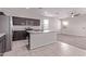 Modern kitchen with stainless appliances, center island, and view into the living area at 28512 N Geode Dr, San Tan Valley, AZ 85143