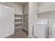 Functional laundry room featuring built-in shelving for optimal storage solutions at 28512 N Geode Dr, San Tan Valley, AZ 85143