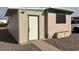 Beige single story home with a white door and driveway at 300 S Val Vista Dr # 77, Mesa, AZ 85204