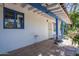 Covered patio with tiled floor, offering outdoor living space and shade at 3303 E Clarendon Ave, Phoenix, AZ 85018