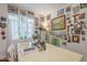 Bright dining space featuring a window with natural light and walls filled with decorative art at 3303 E Clarendon Ave, Phoenix, AZ 85018