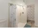 Traditional shower with a white shower curtain and classic white tile work at 3450 W Kaler Dr, Phoenix, AZ 85051