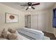 Bedroom featuring a closet, neutral tones, ceiling fan and soft, natural light at 3450 W Kaler Dr, Phoenix, AZ 85051