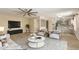 Stylish living room with a modern ceiling fan, complemented by contemporary furnishings and decor at 3450 W Kaler Dr, Phoenix, AZ 85051