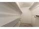 An empty, organized walk-in closet with shelves at 3450 W Kaler Dr, Phoenix, AZ 85051