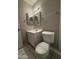 Bathroom featuring tile flooring, vanity with mirror, and toilet at 3827 E Sweetwater Ave, Phoenix, AZ 85032