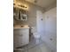 Bathroom featuring tile flooring, vanity with mirror, toilet, and tiled shower at 3827 E Sweetwater Ave, Phoenix, AZ 85032