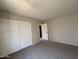 Bedroom featuring a closet with bi-fold doors and neutral walls at 3827 E Sweetwater Ave, Phoenix, AZ 85032