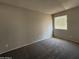 Neutral-toned bedroom with carpet and window providing natural light at 3827 E Sweetwater Ave, Phoenix, AZ 85032