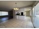 Bright dining area featuring tiled floors, breakfast bar, and patio access at 3827 E Sweetwater Ave, Phoenix, AZ 85032