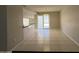 Open dining area with sliding glass doors leading to the backyard and a breakfast bar at 3827 E Sweetwater Ave, Phoenix, AZ 85032