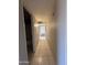Hallway featuring tiled flooring and access to multiple rooms at 3827 E Sweetwater Ave, Phoenix, AZ 85032