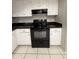 Modern kitchen showcasing black appliances, granite countertops and white cabinets at 3827 E Sweetwater Ave, Phoenix, AZ 85032